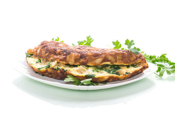 fried omelet with cauliflower and greens in a plate