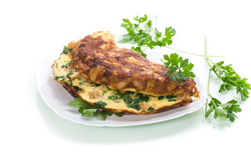 fried omelet with cauliflower and greens in a plate