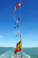 Flags in a small passenger ship to cross the Piedras River. Nature Reserve of Rio Piedras and...