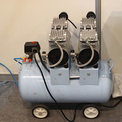 Two motor electric air compressor with 50 l gray receiver tank