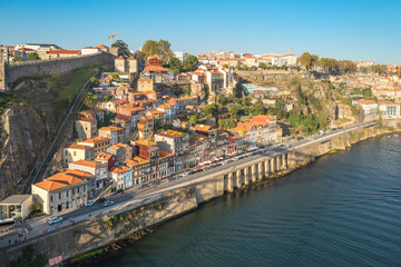 Fototapeta na wymiar Old town of Porto with the Guindais Funicular that leads to quay at Guindais