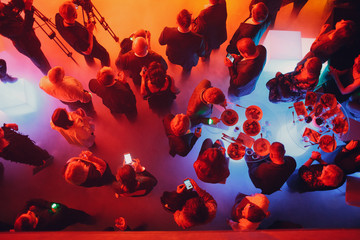 Party and corporate concept. People crowd at the tables top view.
