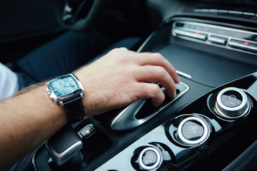 hand on automatic gear shift, Man hand shifting an automatic car