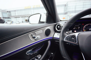 Control buttons on steering wheel. Car interior.