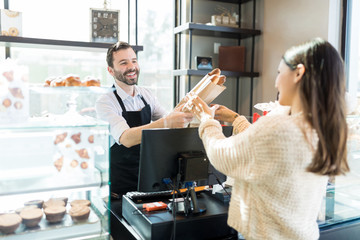 Female Client Buying Baguette From Salesman