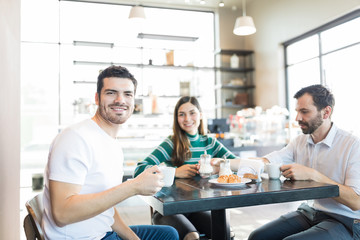 Friends Hanging Out In Cafe