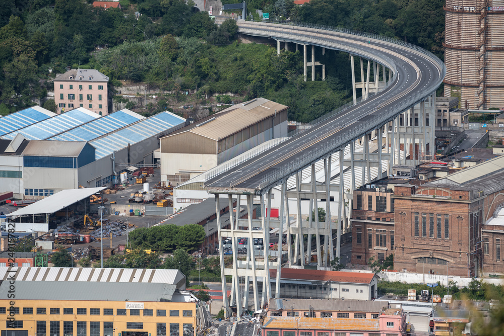 Wall mural Genoa (Genova), Italy, what is left of collapsed Morandi Bridge (Polcevera viaduct) connecting A10 motorway after structural failure causing 43 casualties on August 14, 2018