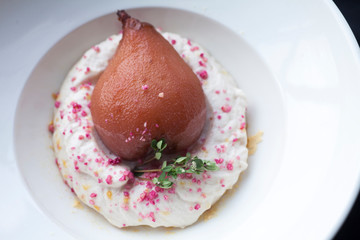 dessert spicy pear on a pillow in a white plate