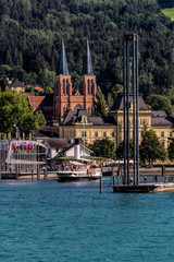 Bregenz Bodensee Hafen mit Leuchtturm und Seepromenade sowie Herz Jesu Kirche
