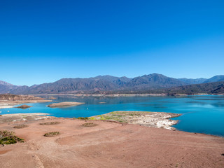 Fototapeta na wymiar View on Potrerillos reservoir and nearby area in Mendoza province in Argentina
