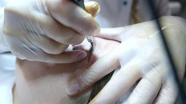 Eyebrow correction. Microblading. Permanent make-up of eyebrows in the beauty salon.