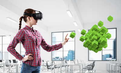 Girl in virtual reality mask experiencing virtual technology wor