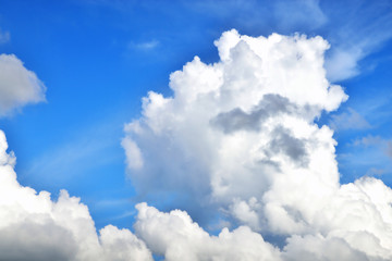 Naklejka na ściany i meble Clouds on the background of bright blue sky, summer day close-up