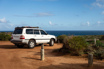 Fototapeta na wymiar White off road car parked in Kalbarri National Park