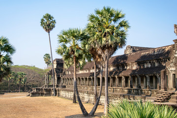 Fototapeta premium View of the main temple at Angkor wat. Originally constructed in the early 12th century, the ruins are a huge tourist attraction as well as a place of worship today