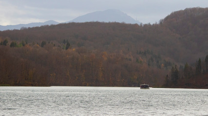 Fototapeta na wymiar Isolated boat adsorbed in Plitvice lakes natural parks