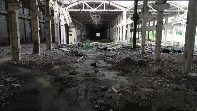 Drone shot flying through a warehouse of a collapsing old factory in Shanghai, China