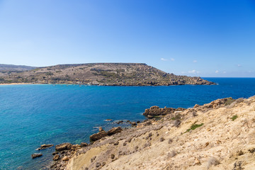 Bay of Gnejna, Malta. Sea, rocks, blue sky