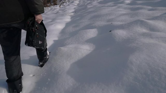 Man goes through deep snow - (4K)
