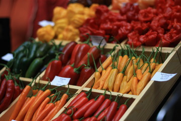 Paprika peppers on holiday celebration with Mexican food. Spicy salsa or taco. Red pepper on urban grocery street market.