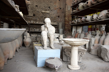 Vases and victim plastered by ash at Pompei disaster, Naples / Italy