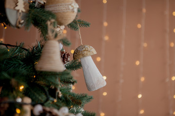 Christmas tree with toys and decorative snow for a happy new year on background of bokee