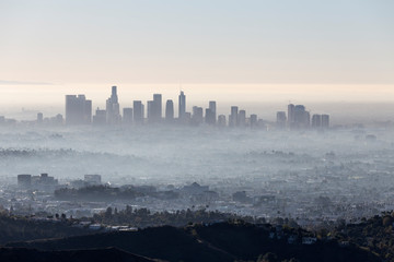 Morning fog cityscape view of downtown Los Angeles from popular Griffith Park near Hollywood...