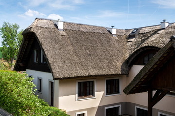 Fototapeta na wymiar Traditional thatched roof from reed, sunny summer day