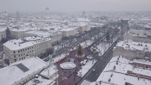 Lviv, Ukraine - December 2018. Arial shot. Opera house. Christmas tree. Christmas Fair. People are walking around the city center