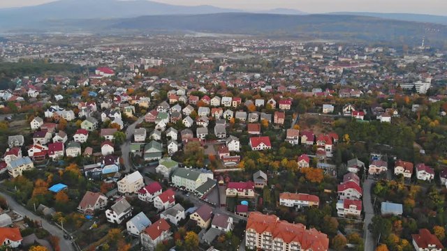 Aerial view of middle class houses in small village or town in the countryside. Top view above houses at sunrise above in the autumn Uzhhorod Ukraine Europe