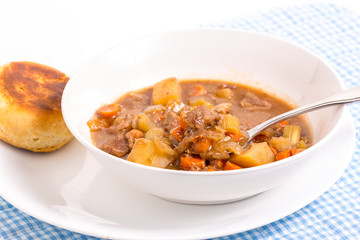 Bright Backlight on Bowl of Beef Stew and Biscuit