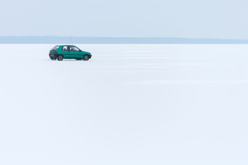 Masuria Region, Poland - January, 2009: car on the frozen Sniardwy Lake in winter, Sniardwy is the largest lake in Poland