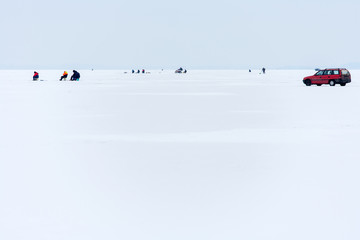 Masuria Region, Poland - January, 2009: anglers on the frozen Sniardwy Lake in winter, Sniardwy is the largest lake in Poland
