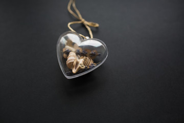 Valentines day background. Glass heart isolated on black.