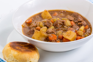 Harsh Light on Biscuit and Bowl of Beef Stew