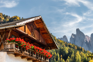 Fototapeta na wymiar A traditional South Tyrol chalet house in the Dolomites.