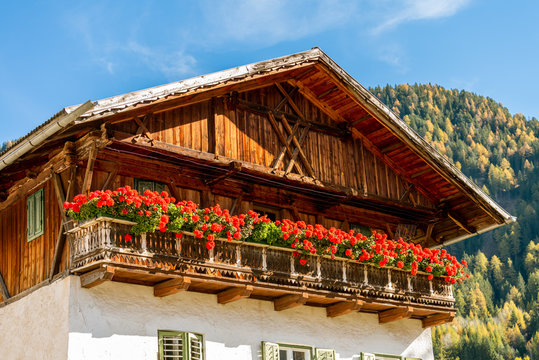 A traditional South Tyrol chalet house in the Dolomites.