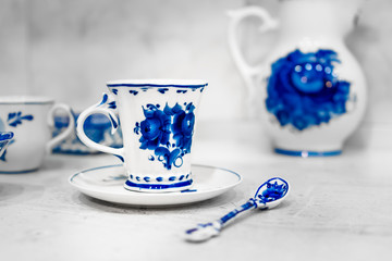 dishes and decorative elements painted in the style of Gzhel, tea, coffee 