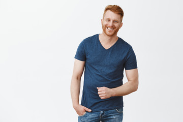 Hey charming, what is your number. Portrait of handsome masculine redhead male in blue t-shirt,...