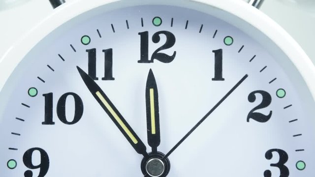 Timelapse Have lunch break. The beginning of time 11.45 run fast.Spinning all the time. Close up, on white background.
