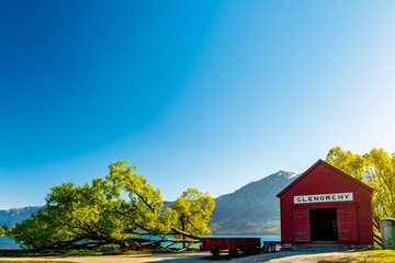 Iconic red building and Beautiful scenery beside the lake at Glenorchy, New Zealand.