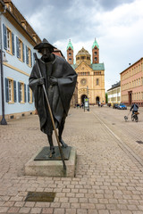 Statue of a pilgrim on his way to santiago de compostela in front of Speyer Cathedral, Speyer, Germany - obrazy, fototapety, plakaty