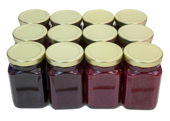 Isolated top and front view of a case of homemade organic jams, jellies and preserves.