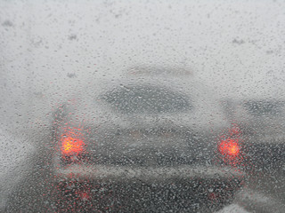 car on the road during a snow storm