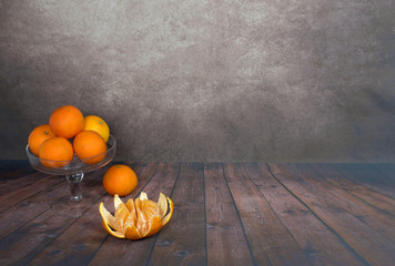 Still Life mandarins in glass vase, table