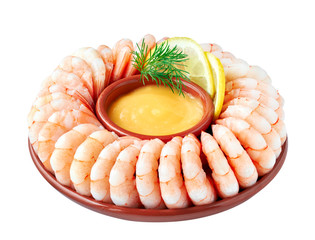 Close-up on shrimp ring with seafood sause, lemon and dill isolated on white