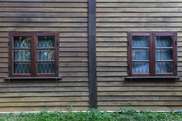 Fototapeta na wymiar Two wooden window on wood wall background. Texture vintage for interior.