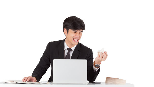 A handsome businessman crunched report with displeased emotion face. A young CEO furious with mistake report. Business man hand crunching a piece of white paper in anger on white background. - Powered by Adobe