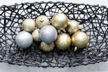 Gold and Silver Christmas balls in basket