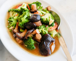 broccoli cooked shiitake mushrooms / stir fried shrimp broccoli vegetable with oyster sauce mushrooms on white plate